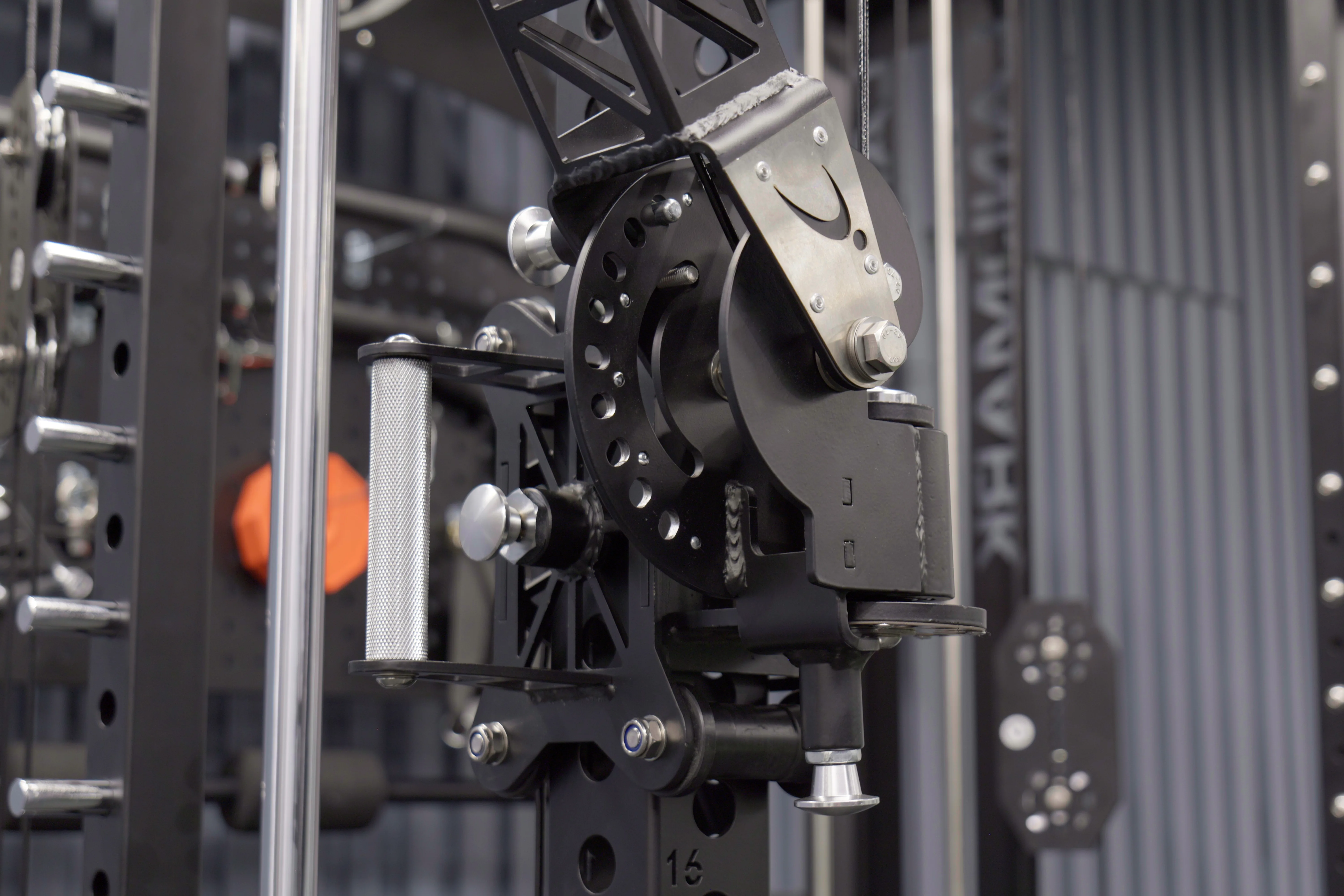 Close-up of the Everest front pivot arm trolley showing the swivel pulley, adjustment pin, and knurled cable handle.